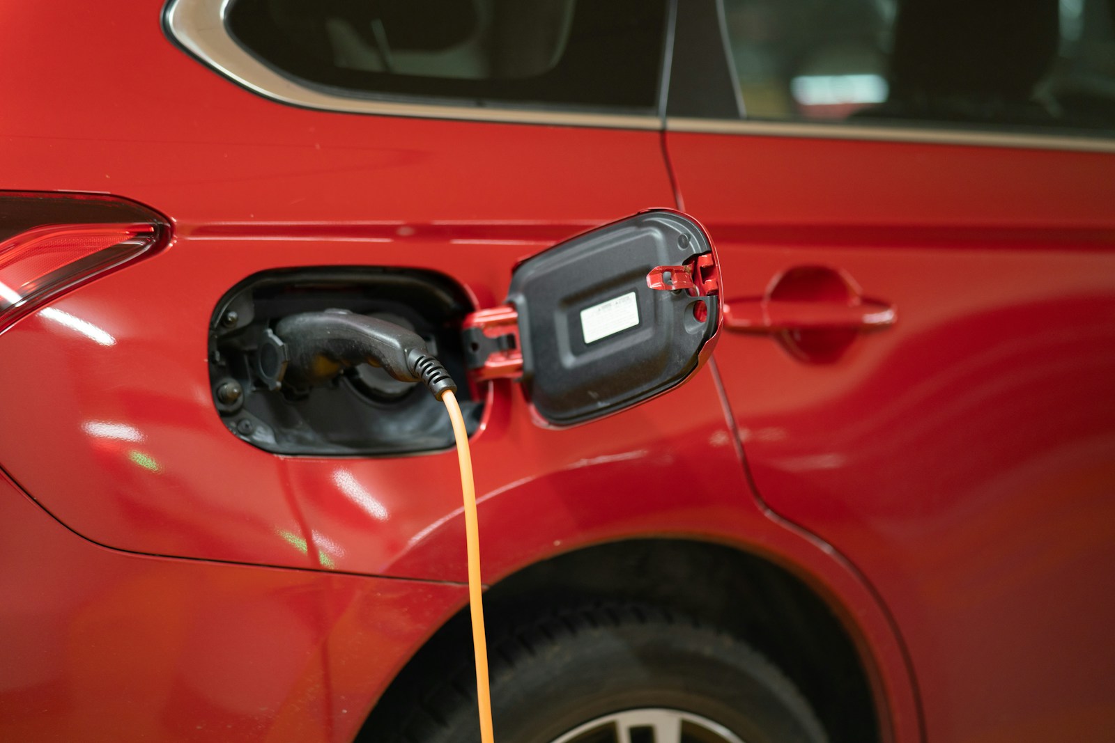 red electric car plugged in